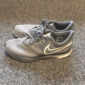 Gray and white Nike shoes